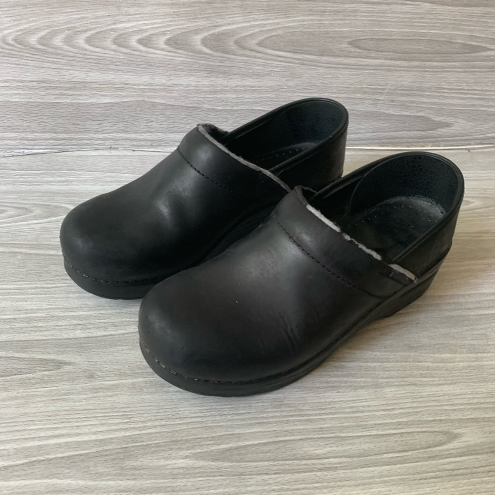 Dansko black clogs. Some damage